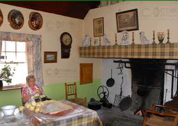 The Clare Gallery. Preparing apple pie in an Irish cottage - Co. Clare 