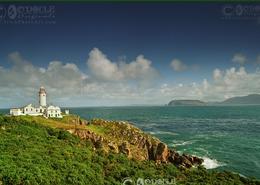 The Donegal Gallery. The Sun Shining on Fanad Head Light House - Co. Donegal