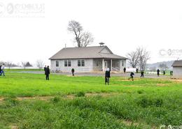 Fields Of Gold - The Amish Way. Amish Children Outside Playing at their One Room School House