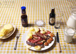 Traditional Irish Cottage Food. Skillet fried Pigs liver and bacon with boiled potatoes and wild field mushrooms